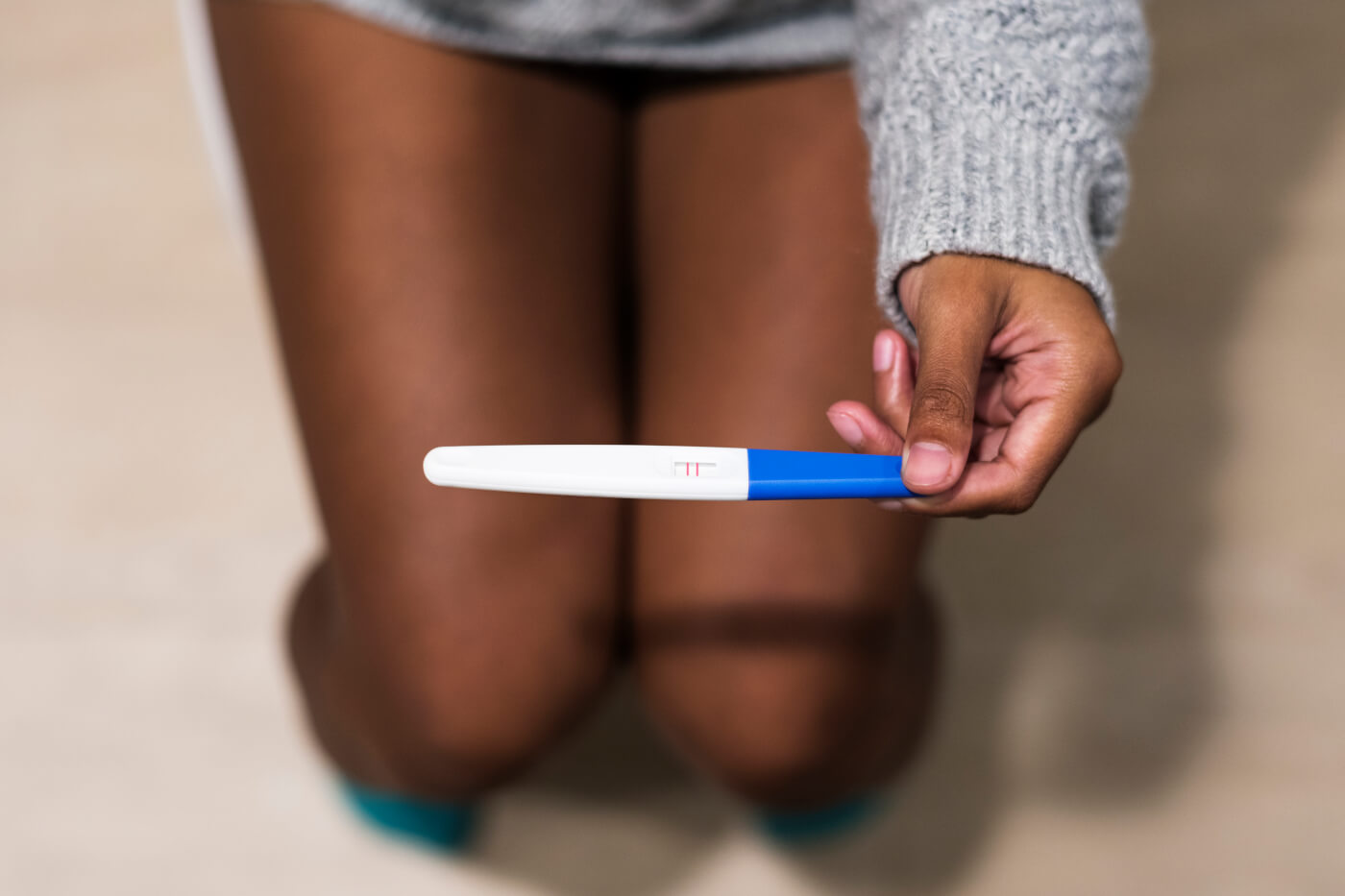 Teenager with a pregnancy test